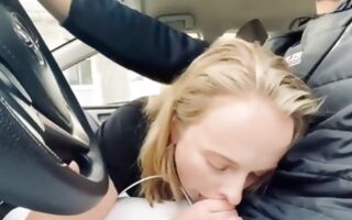 Hot blonde in the car blowing a huge and tasty dick