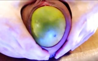 Raunchy whore with a stretched pussy puts an apple inside